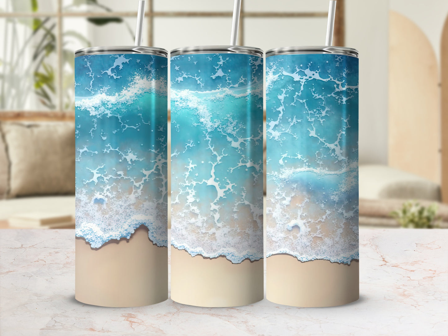 Three tumblers with a realistic ocean wave and sand design.