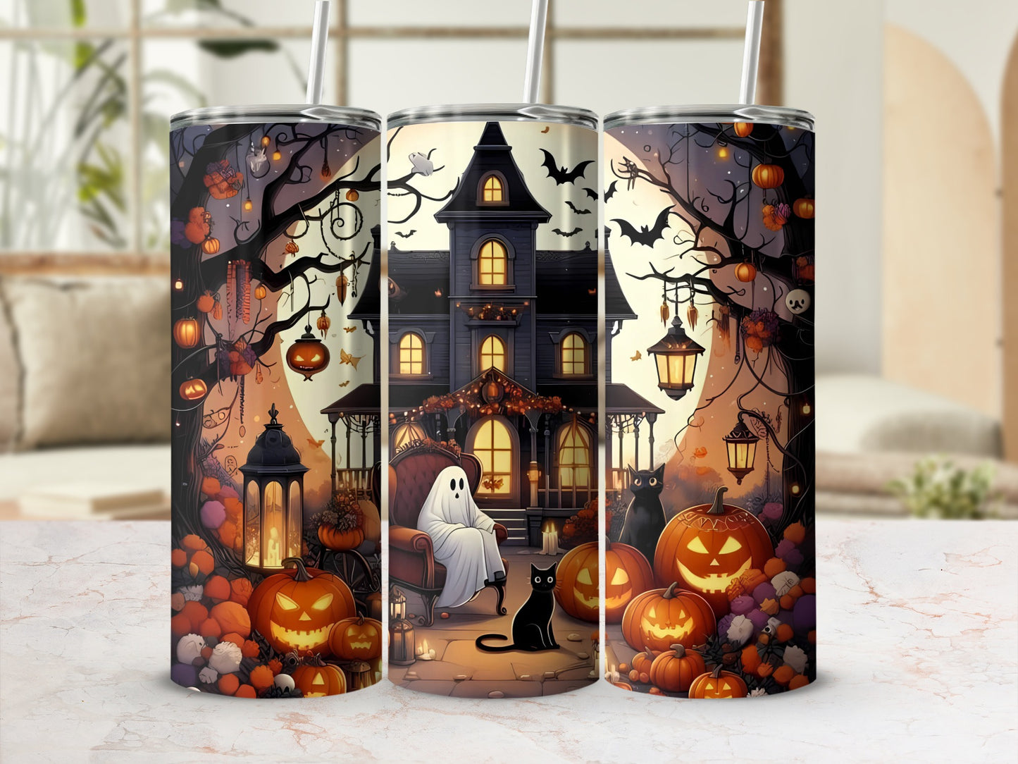 Three tumblers with a Halloween design featuring pumpkins, a haunted house, cats, and a ghost.