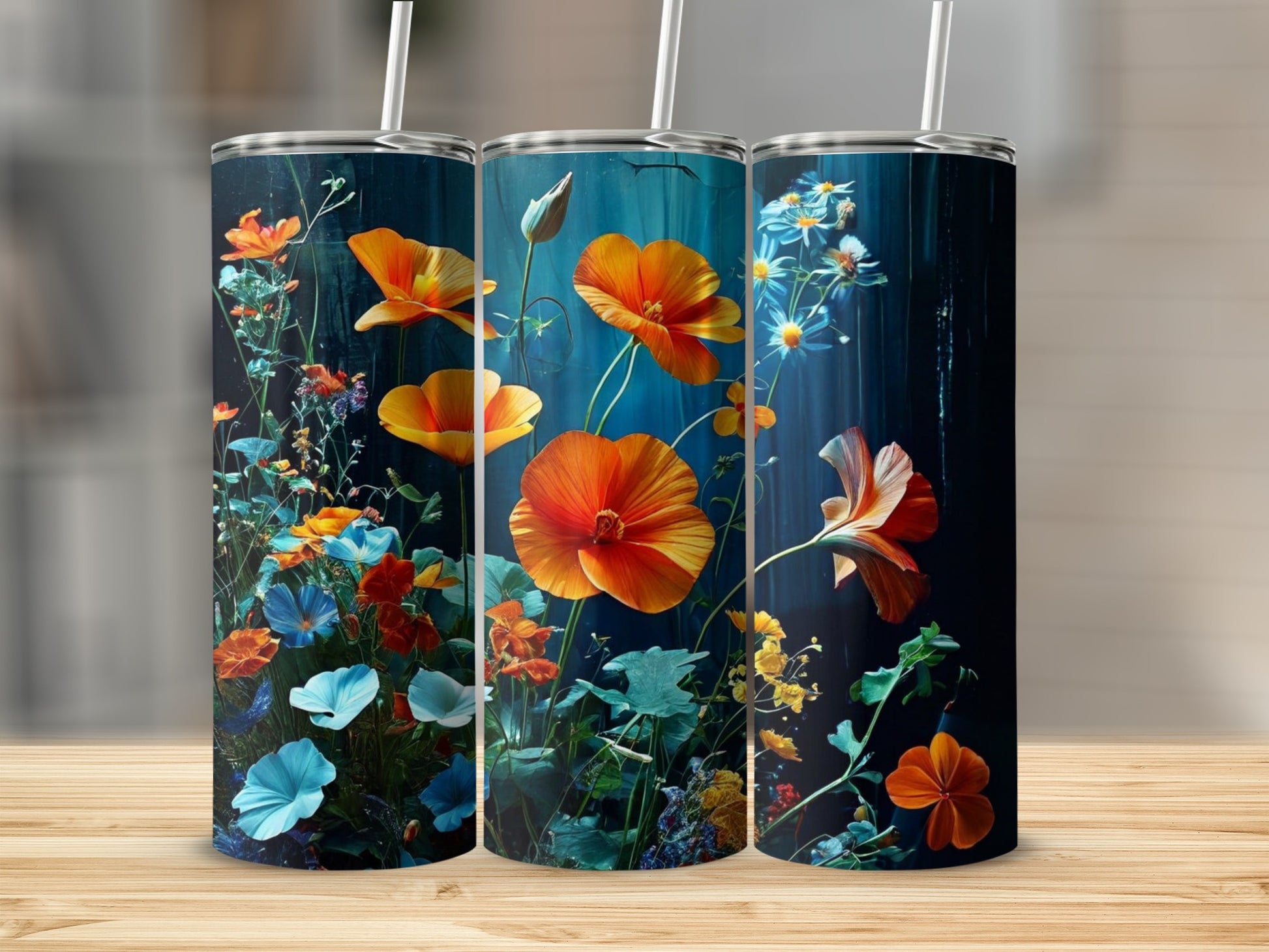 Three tumblers with a dark floral design featuring orange and blue flowers.