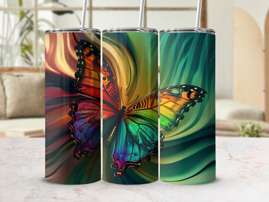 Three tumblers with colorful butterfly designs and abstract backgrounds.