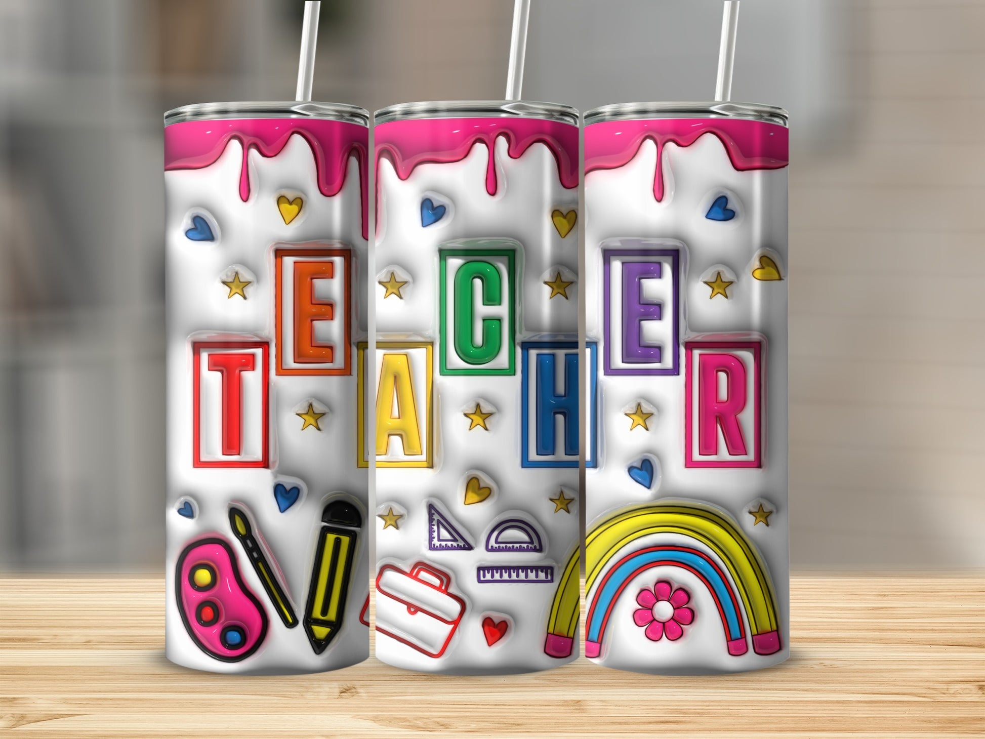 Three tumblers with colorful teacher-themed designs.
