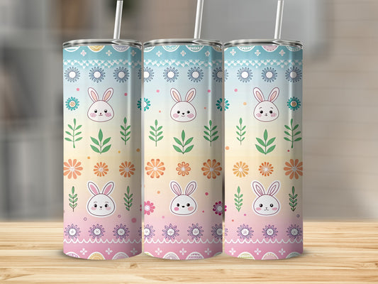 Three tall tumblers with cute bunny and floral patterns.