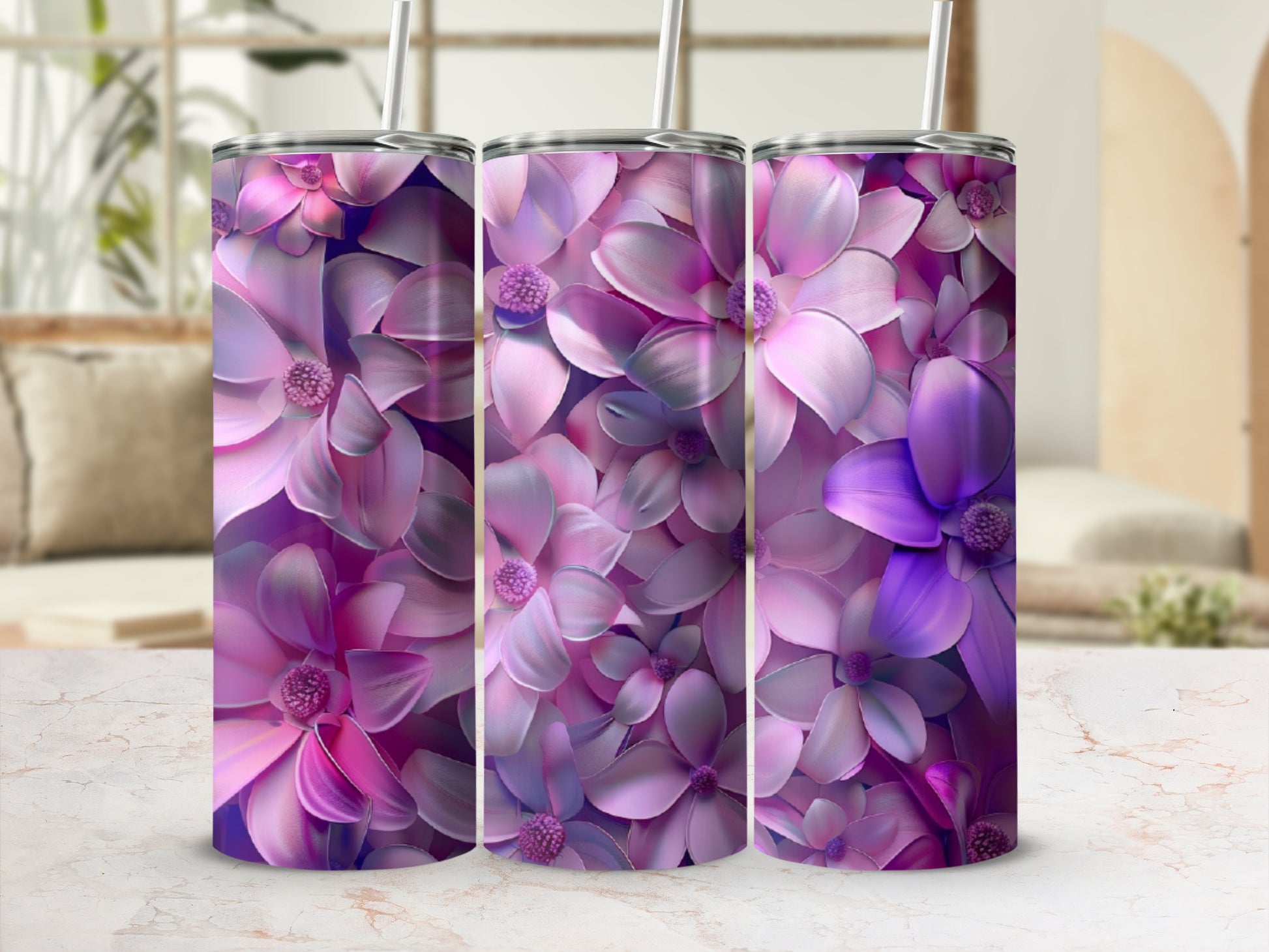 Three tumblers with a vibrant floral pattern of pink and purple petals.