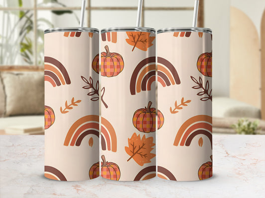 Three tumblers with autumn-themed pattern of pumpkins, leaves, and rainbows.