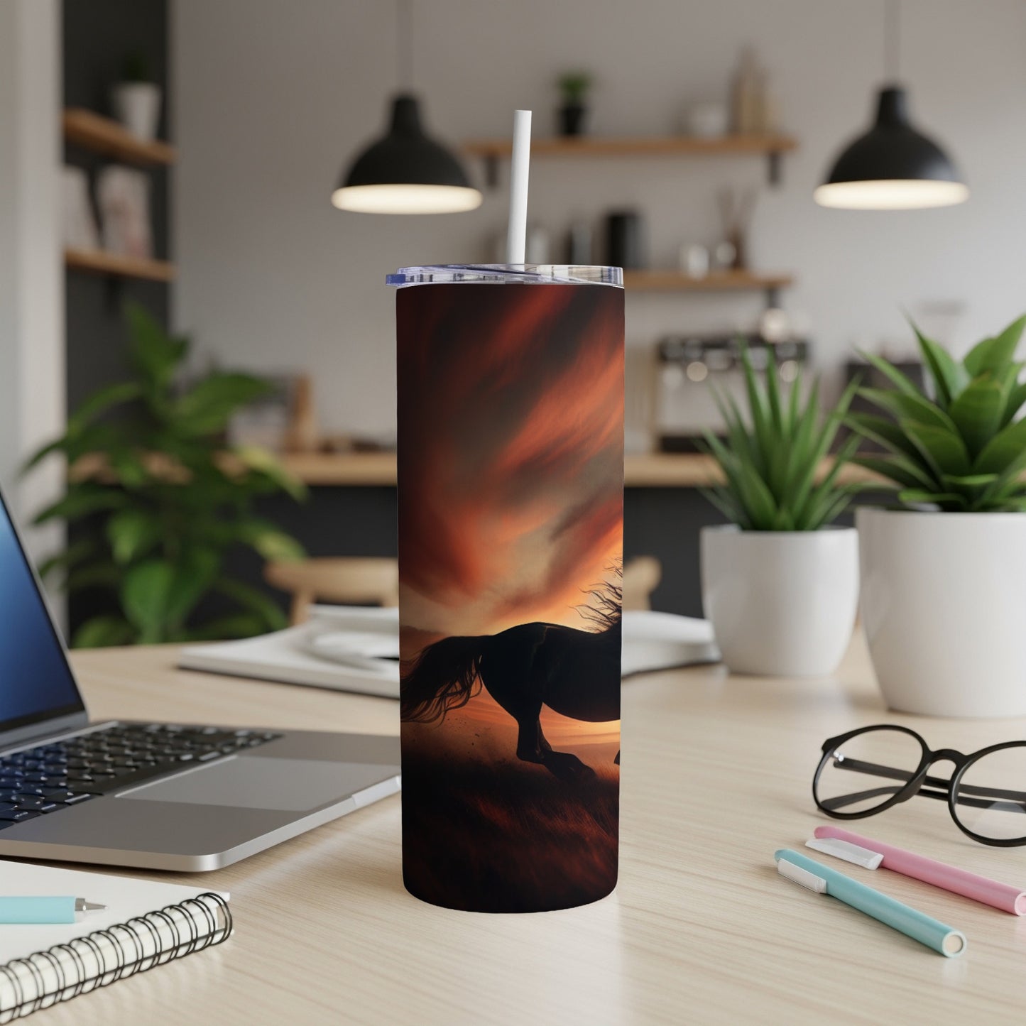 Black horse silhouette gallops against vibrant sunset on a skinny tumbler.