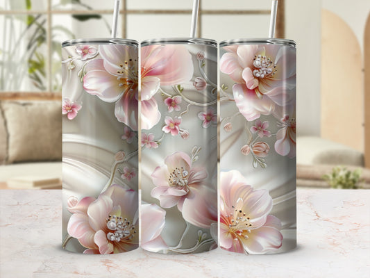 Three tumblers with a delicate floral and vine design in pink and white.