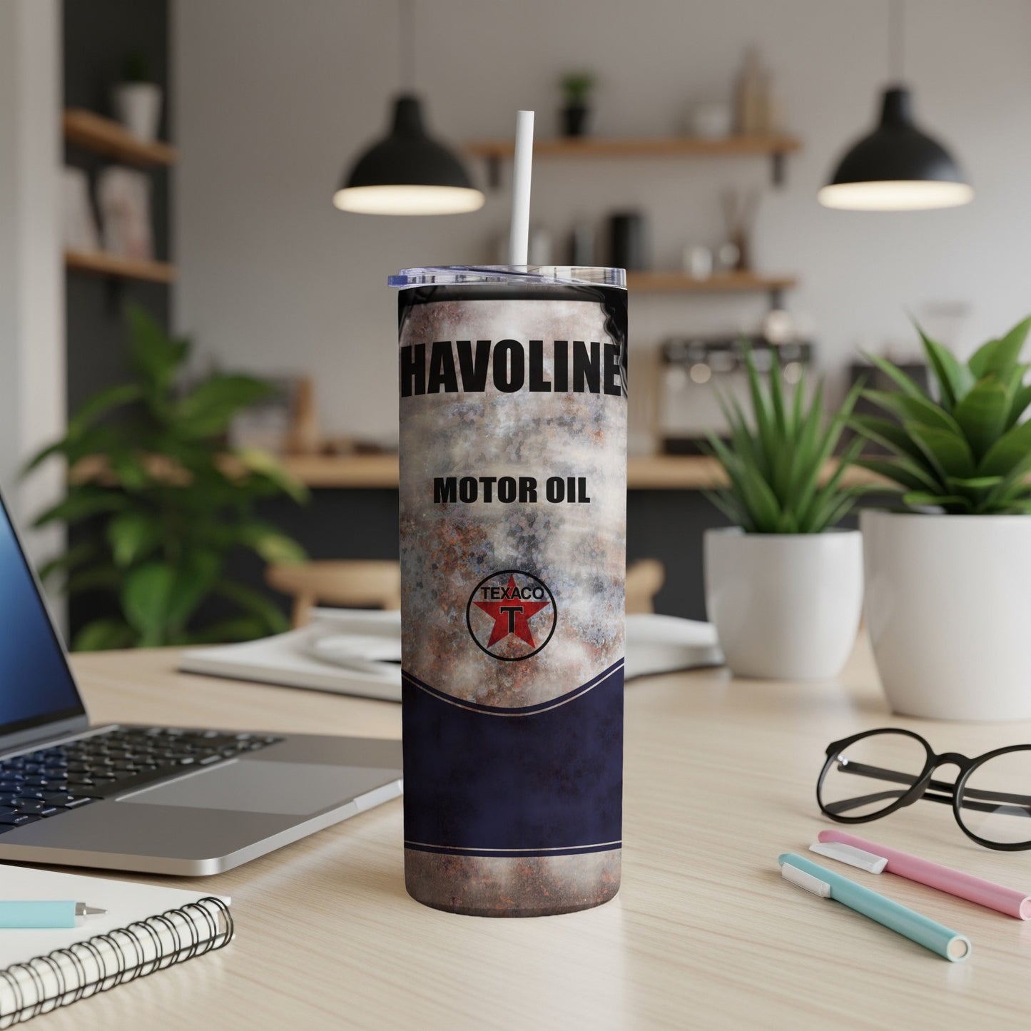 Havoline Motor Oil Texaco insulated tumbler with straw on a desk.