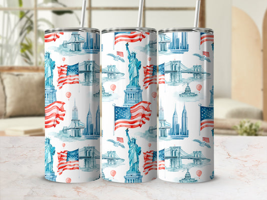 Tumbler with repeating pattern of New York landmarks and American flags.