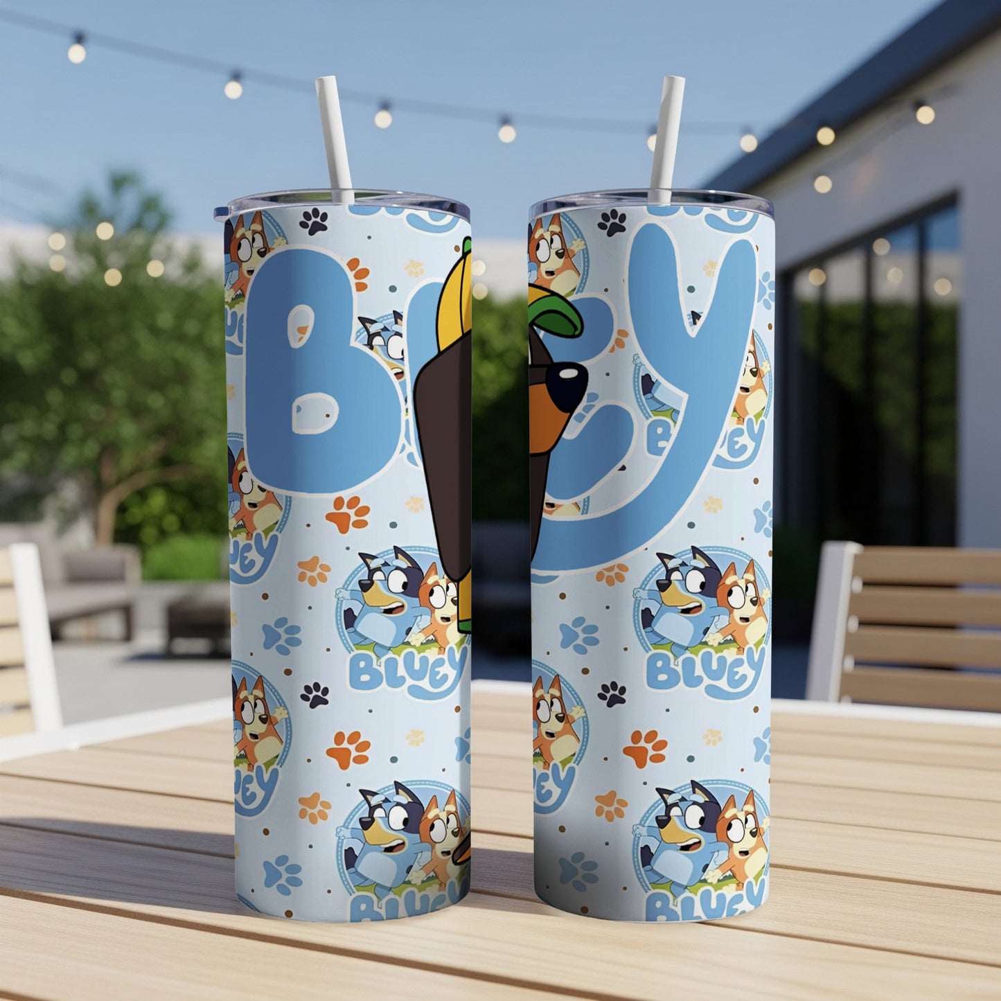 Bluey and Bingo characters on a blue patterned tumbler with straw.