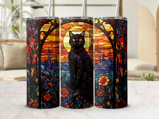 Black cat with yellow eyes on a stained-glass background of flowers and sunset.