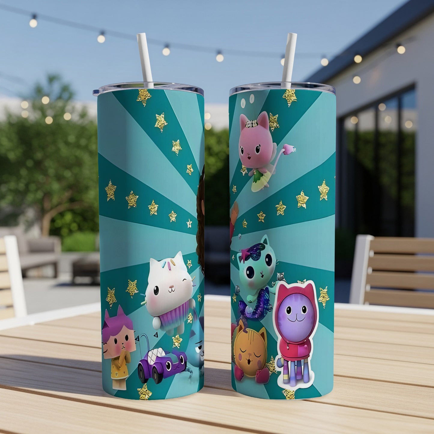 Two Gabby's Dollhouse tumblers with characters on a table.