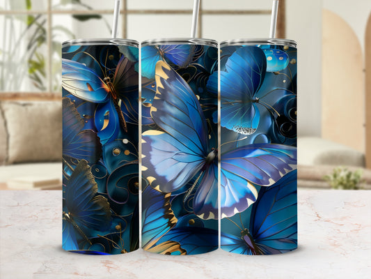Three blue butterfly tumblers with gold accents and straw.