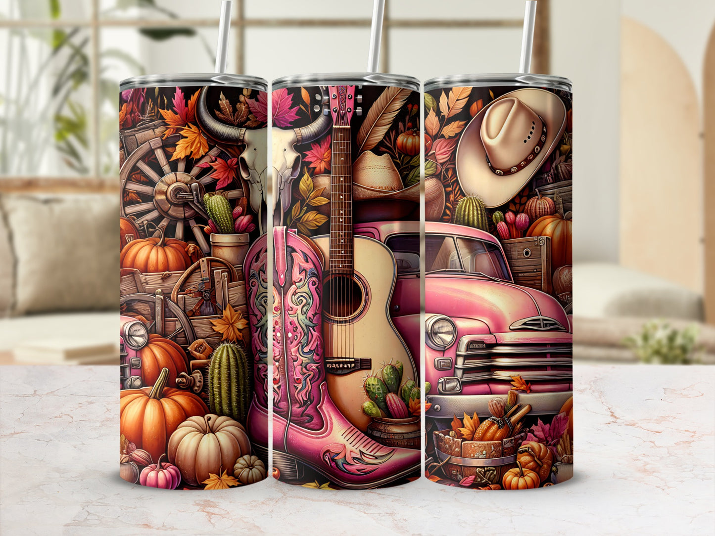 Pink guitar, cowboy hat, and pumpkins on a tumbler with country western motifs.