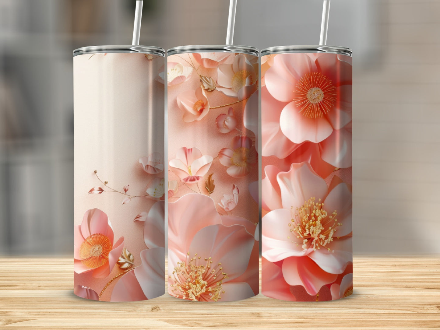 Pink floral tumbler with straw on a wooden surface.