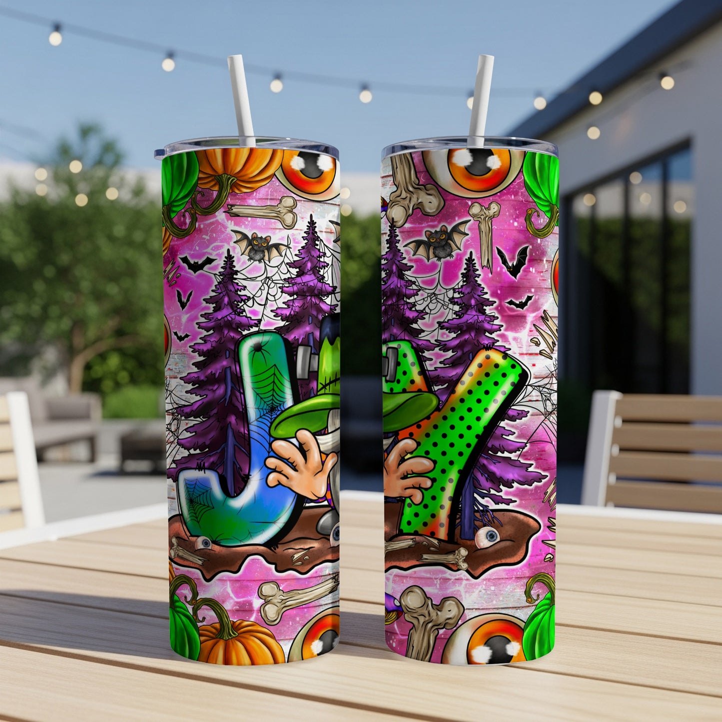 Two tumblers with Halloween J-O-Y design and spooky graphics.