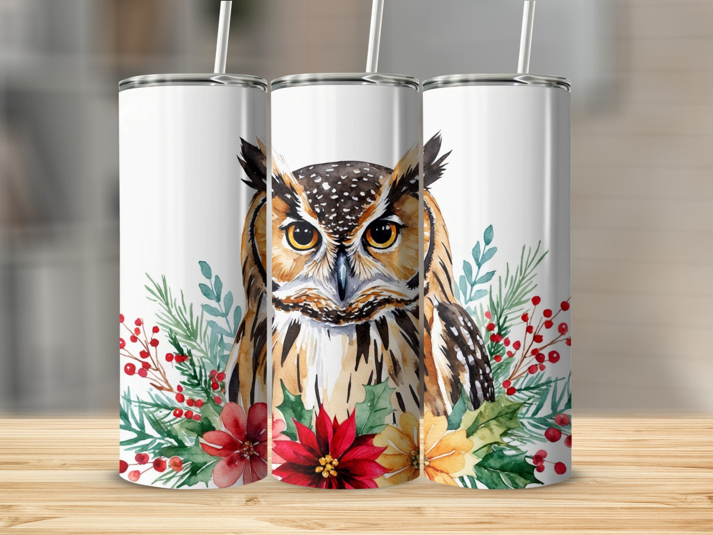 Watercolor owl with festive greenery and flowers wraps around three white tumblers.