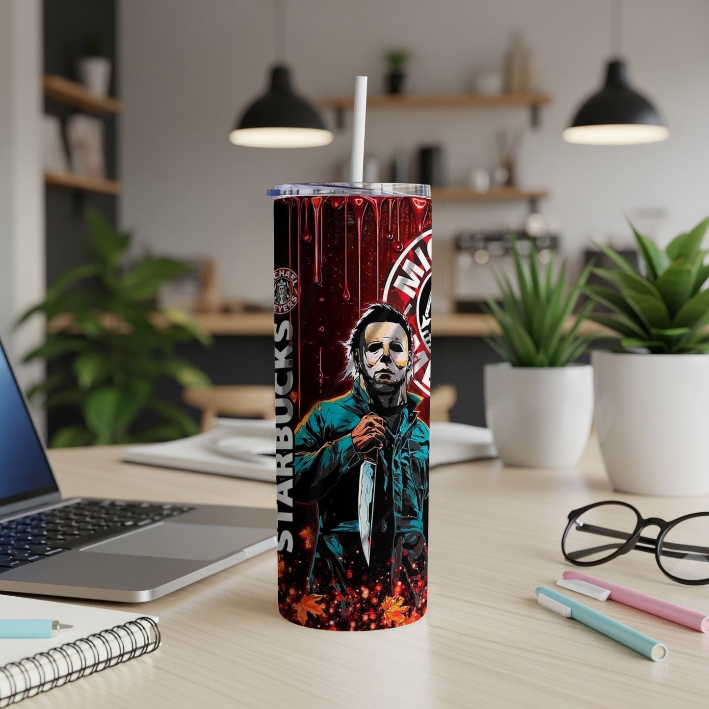 Michael Myers Halloween tumbler with Starbucks logo and fallen leaves.