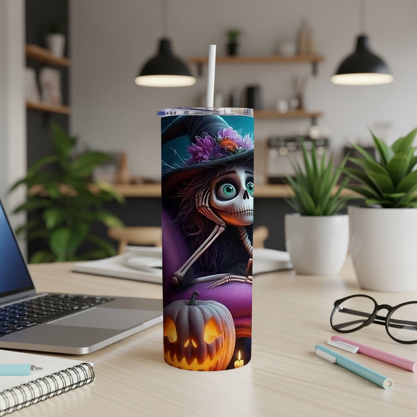 Tumbler with skeleton wearing a witch hat and holding flowers, beside a jack-o'-lantern.