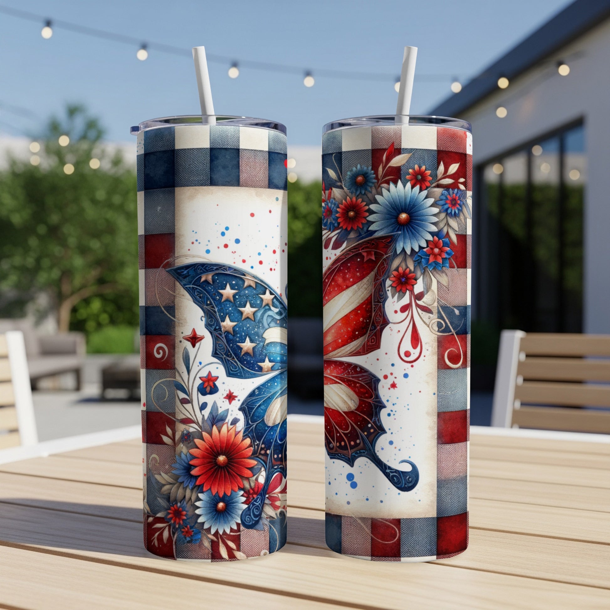 Two tumblers with patriotic butterfly and floral designs on a table.