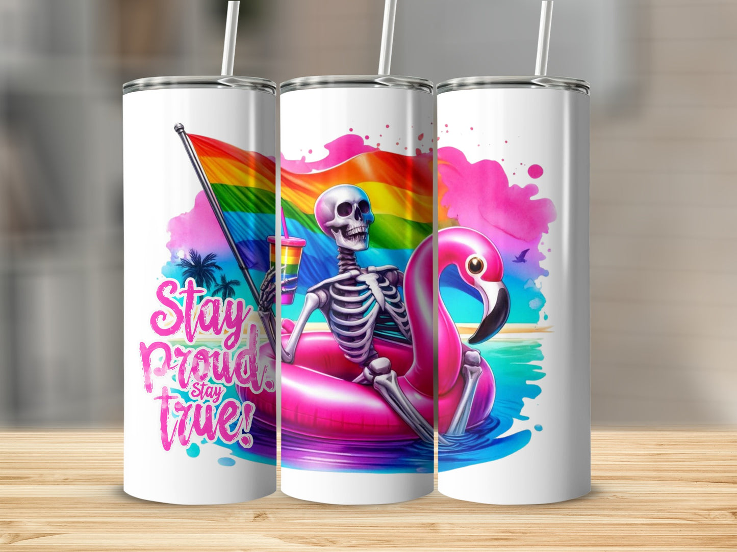 Skeleton floating on a pink flamingo with rainbow pride flag and "Stay Proud! Stay True!" text.