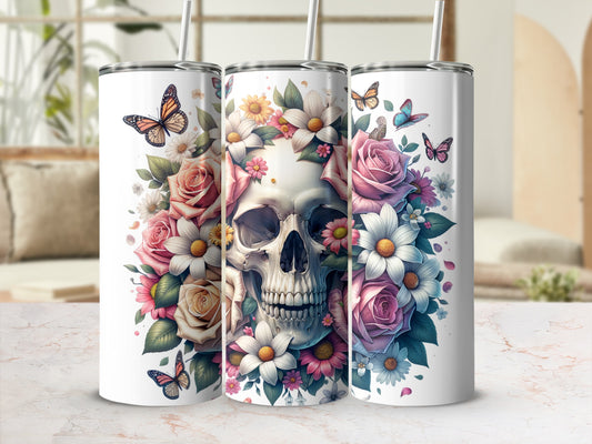 Three tumblers with floral skull designs and butterflies.