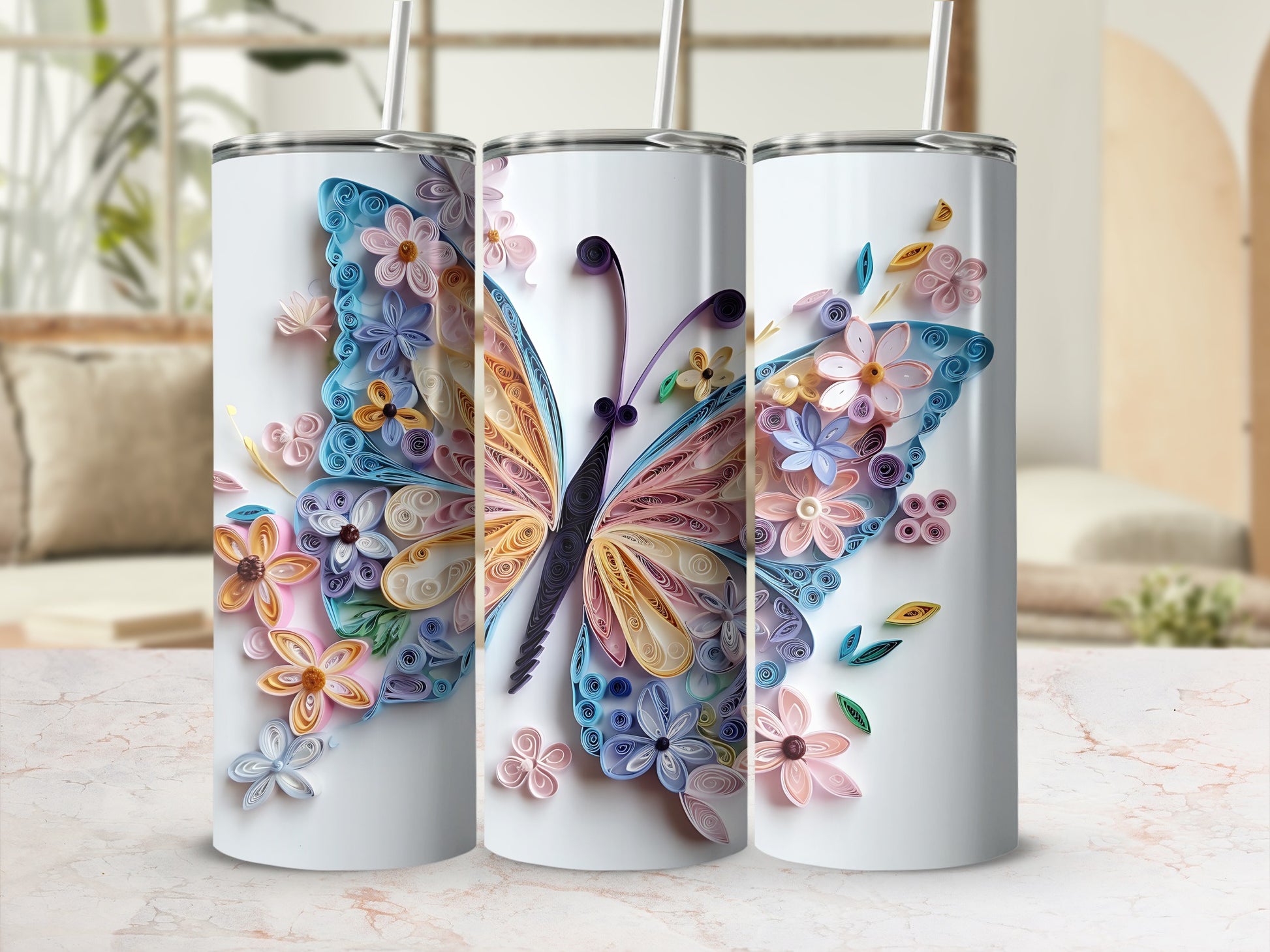 Three tumblers with a quilled butterfly and floral design in pastel colors.