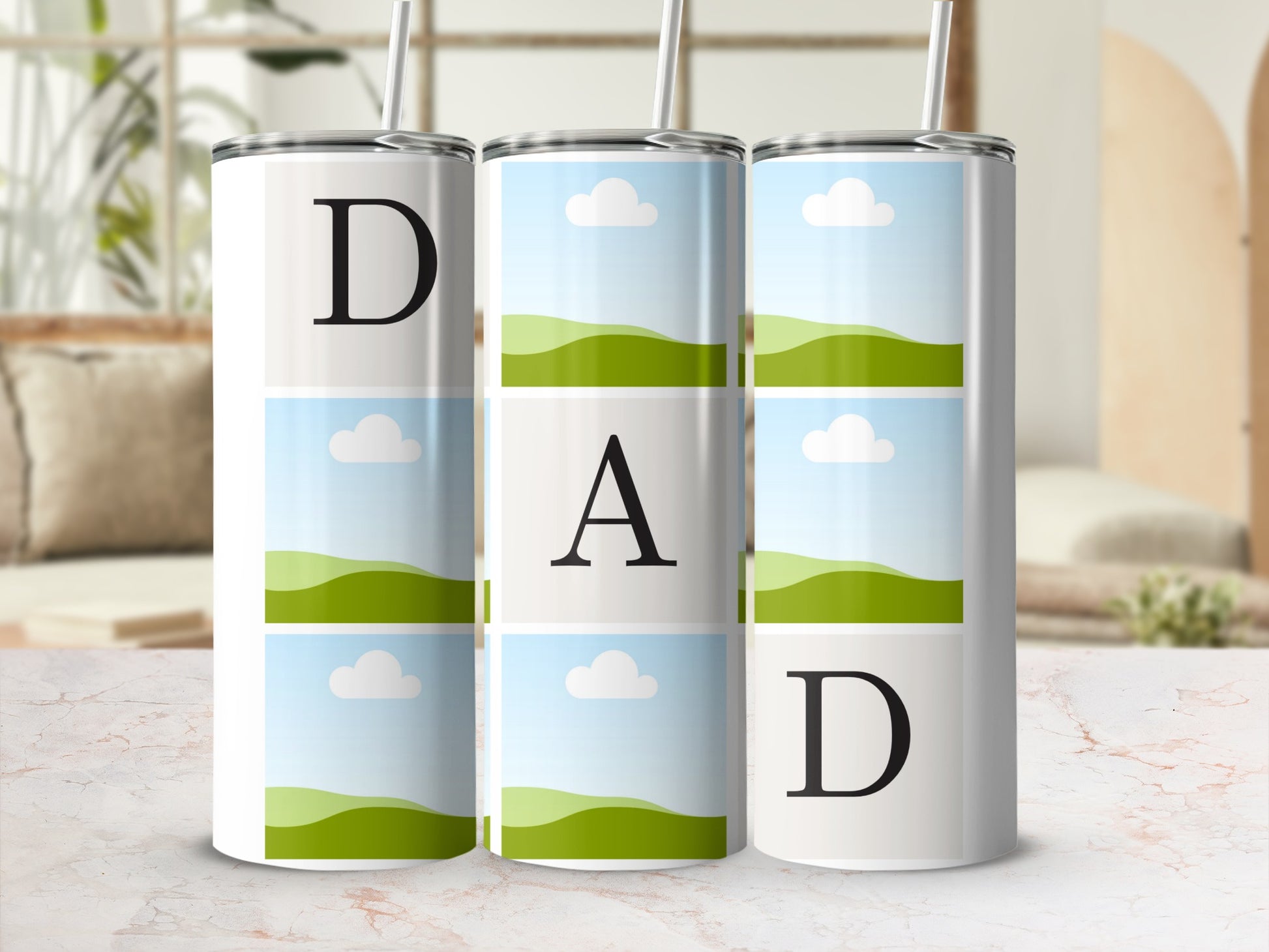 Three tumblers display the word "DAD" formed by a letter and framed landscape images.