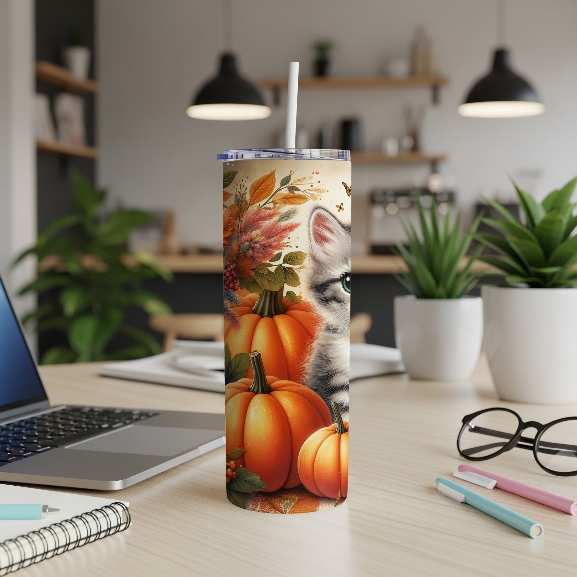 Tumbler with cat and pumpkins, a fall-themed design.