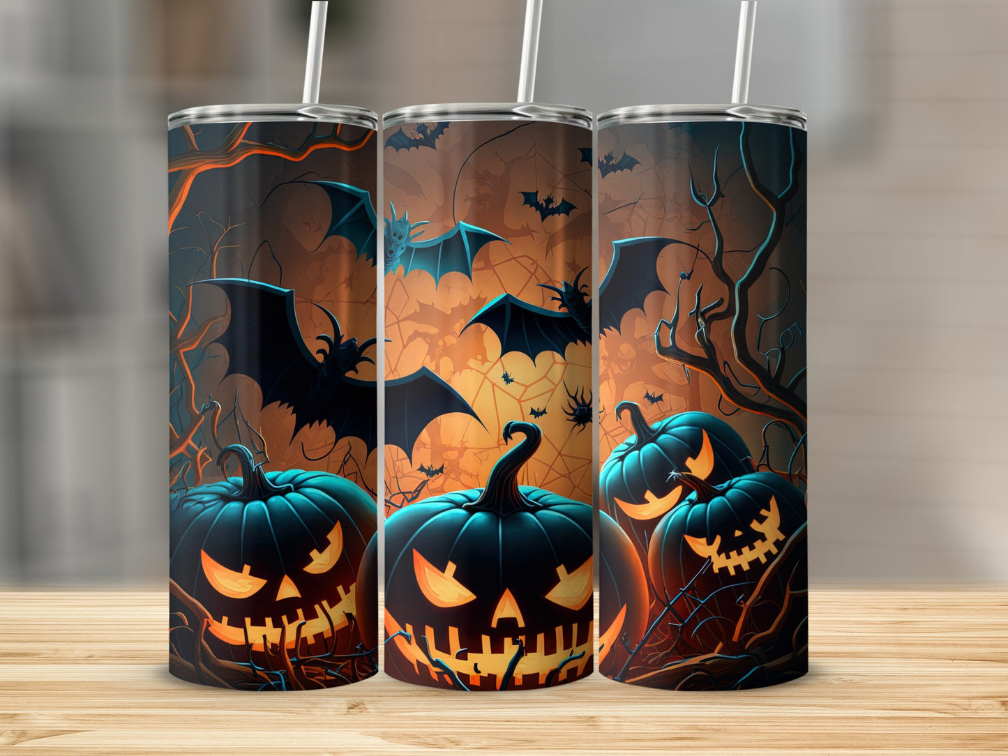 Three tumblers feature a Halloween design with jack-o'-lanterns and bats against a dark background.
