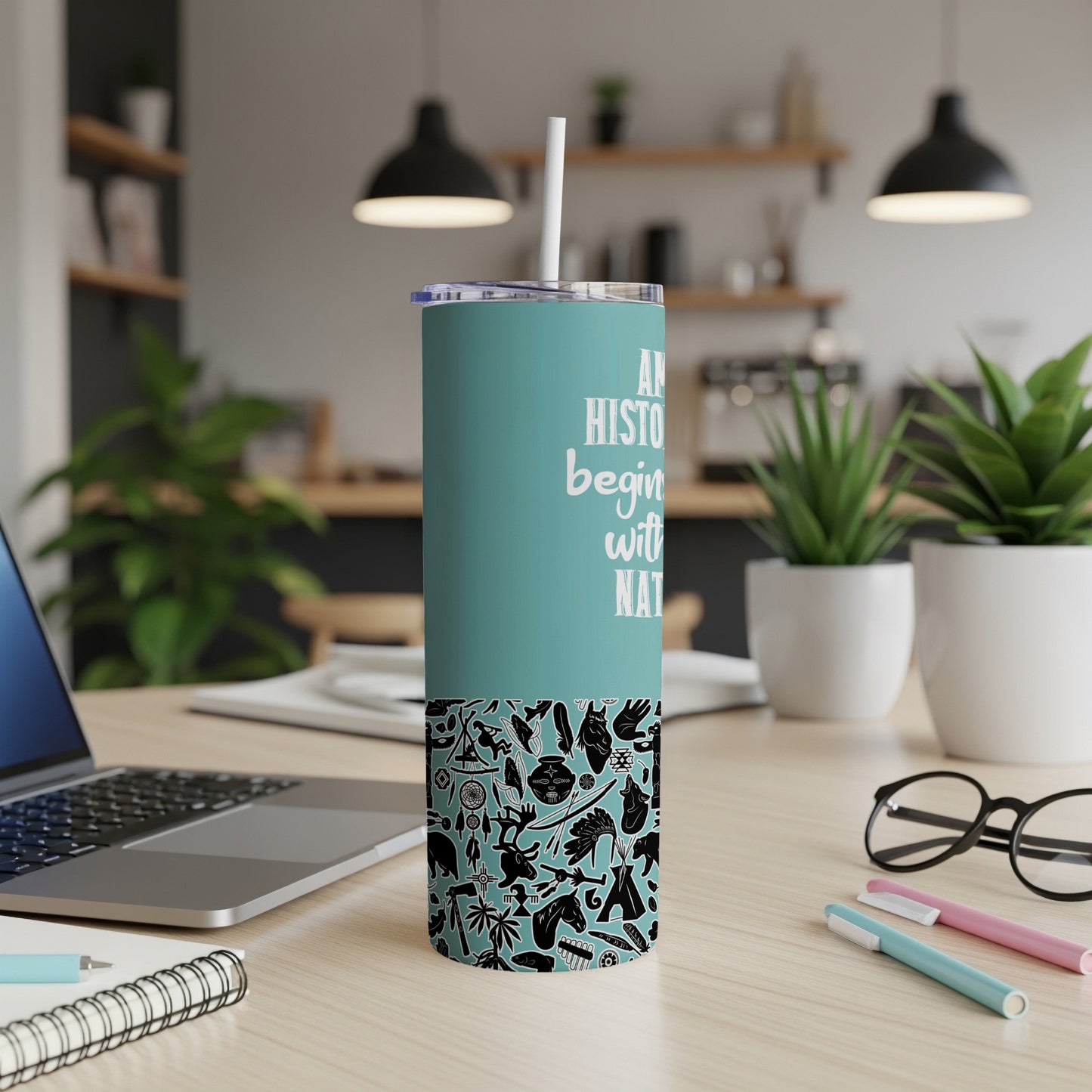 Teal tumbler with Native American inspired patterns and text "AN HISTORY BEGINS WITH NAT".