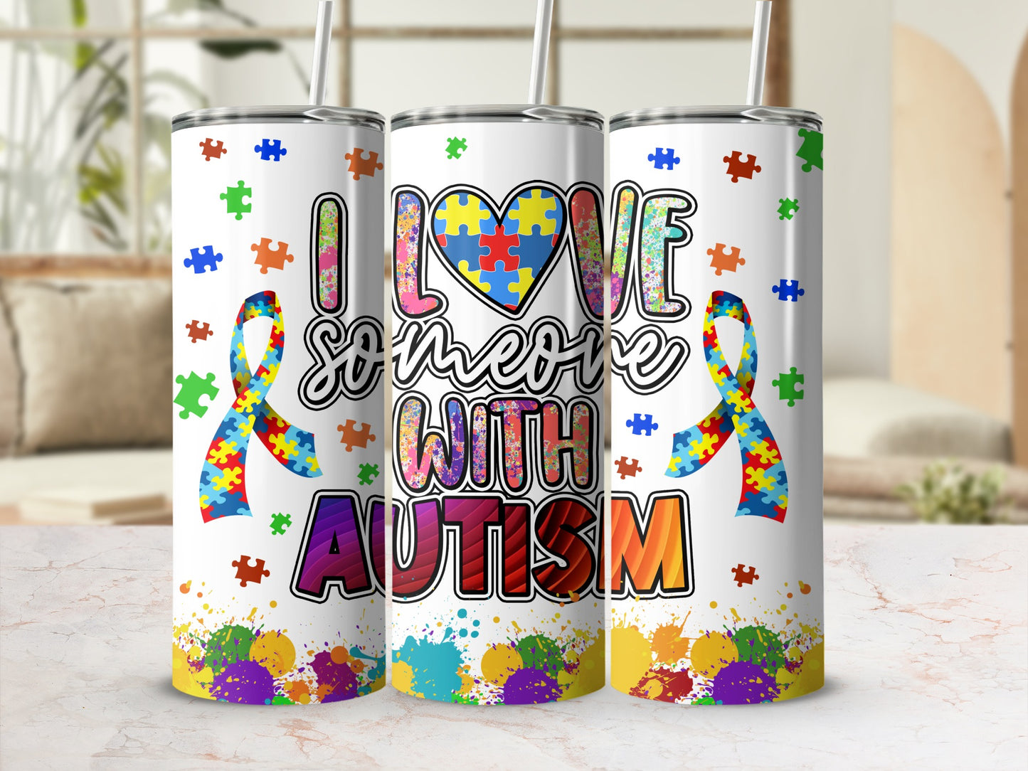 Tumbler with "I love someone with autism" text and puzzle pieces.