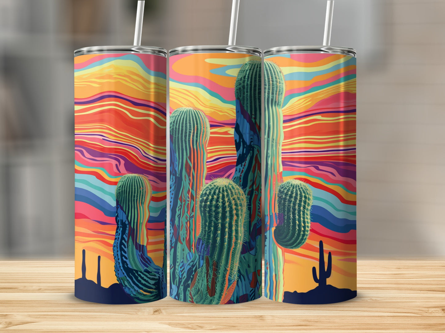 Tall desert cacti with colorful, abstract sunset background on three tumblers.