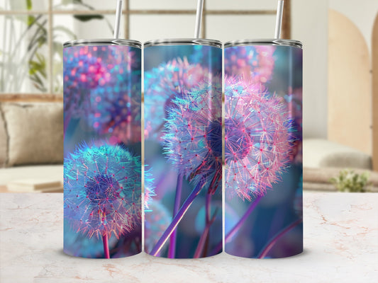 Three tumblers with a glowing dandelion motif on a marbled surface.