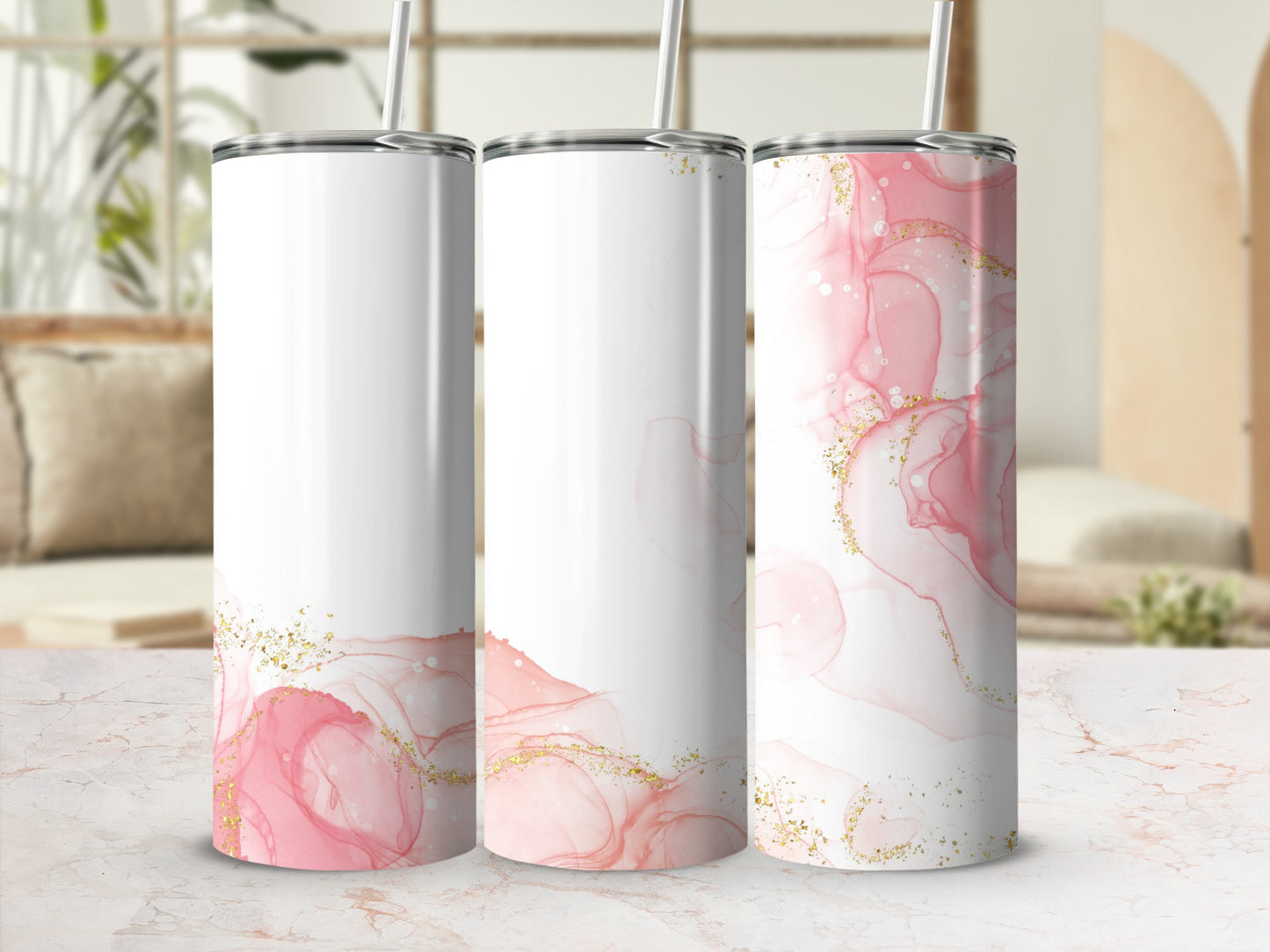 Three white tumblers with pink and gold marbled design.
