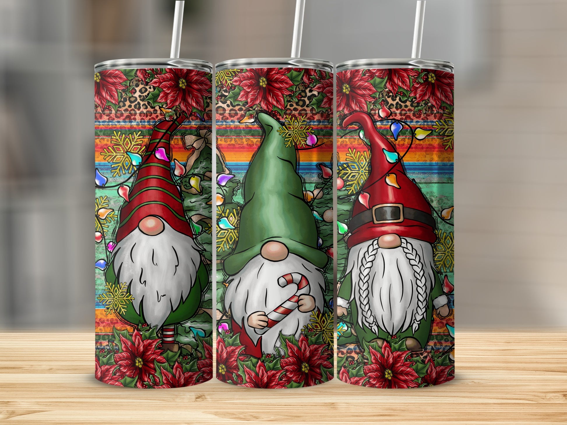 Three Christmas gnomes with candy canes and festive decorations on patterned tumblers.
