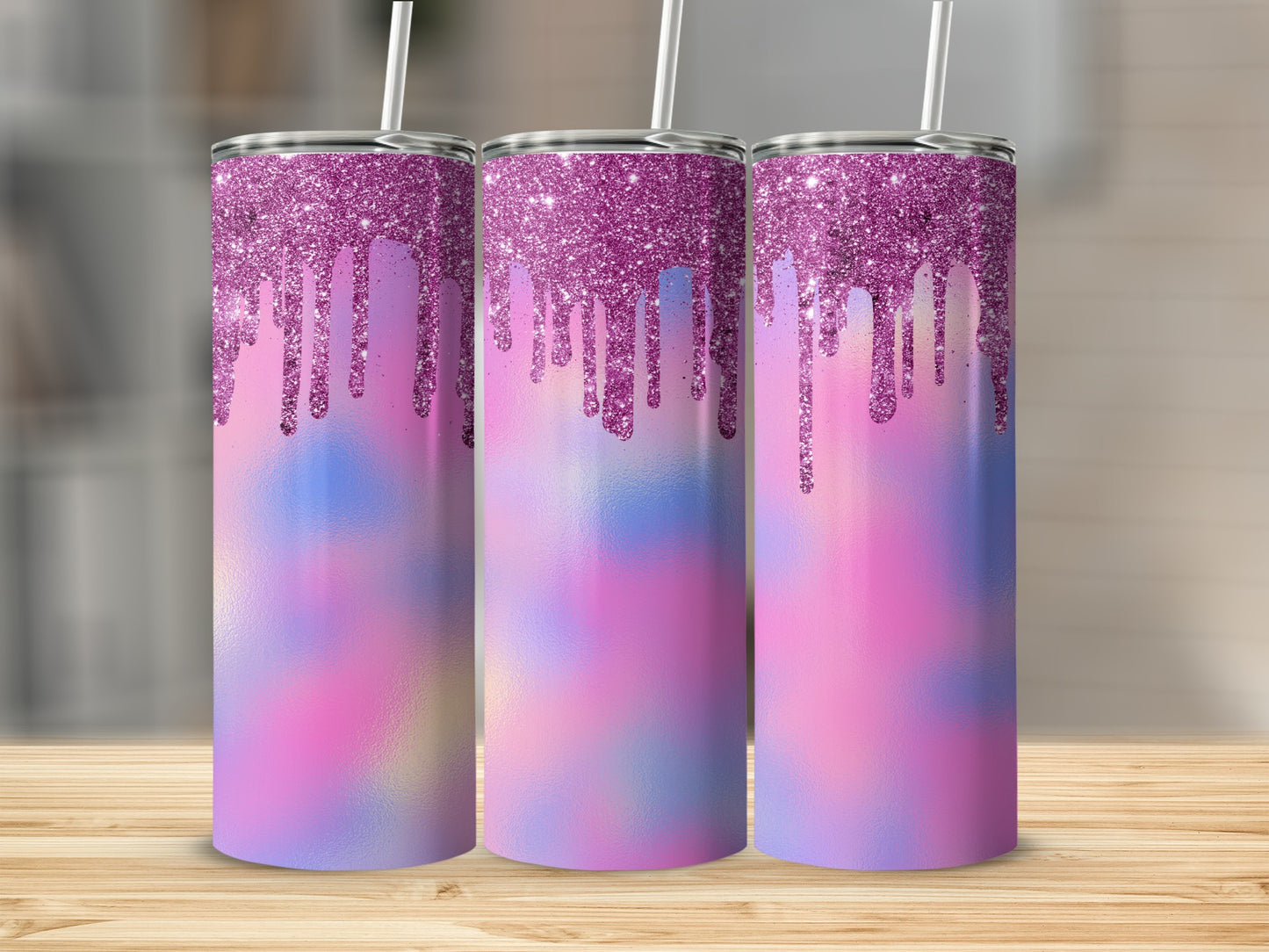 Three tumblers with pink glitter drip and tie-dye design on wooden surface.
