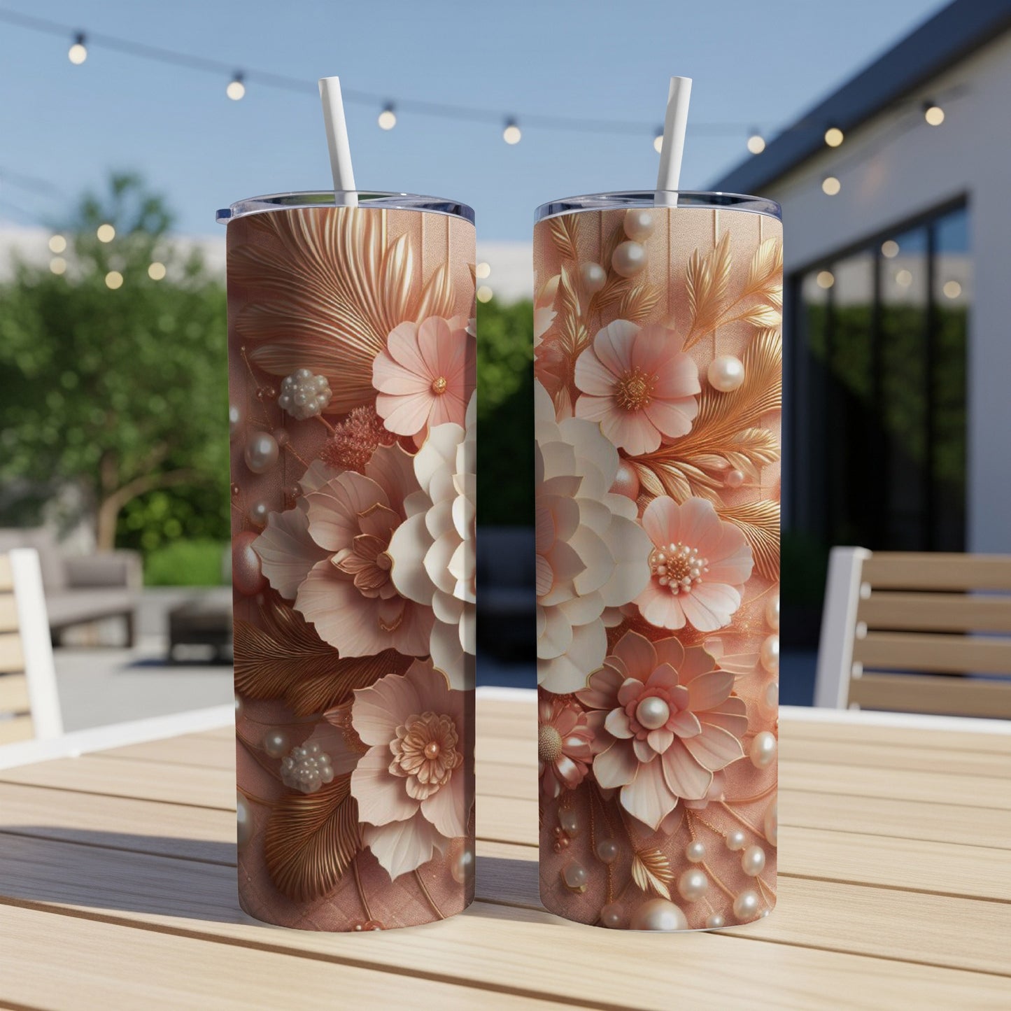 Two tall, rose gold tumblers with intricate floral and pearl designs.