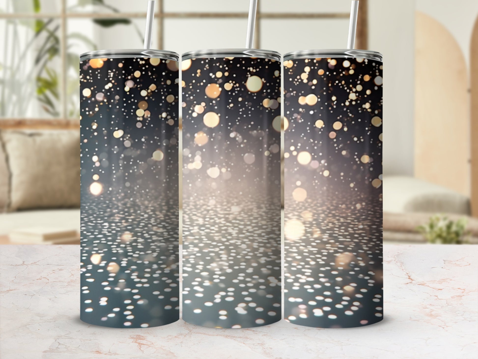 Three tumblers with bokeh light pattern on a marble surface.