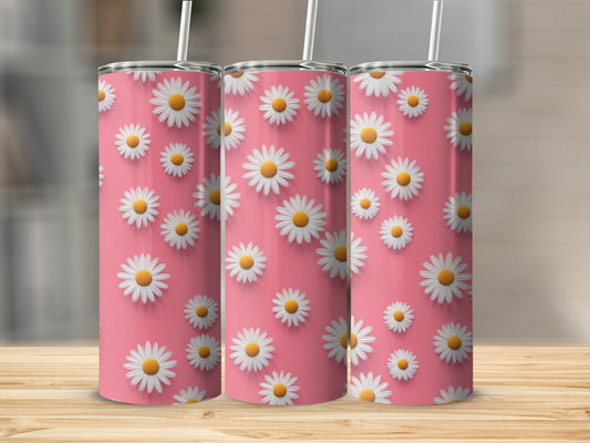 Three tumblers with white daisy patterns on a pink background.