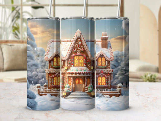 Three tumblers display a festive gingerbread house design in a snowy winter landscape.