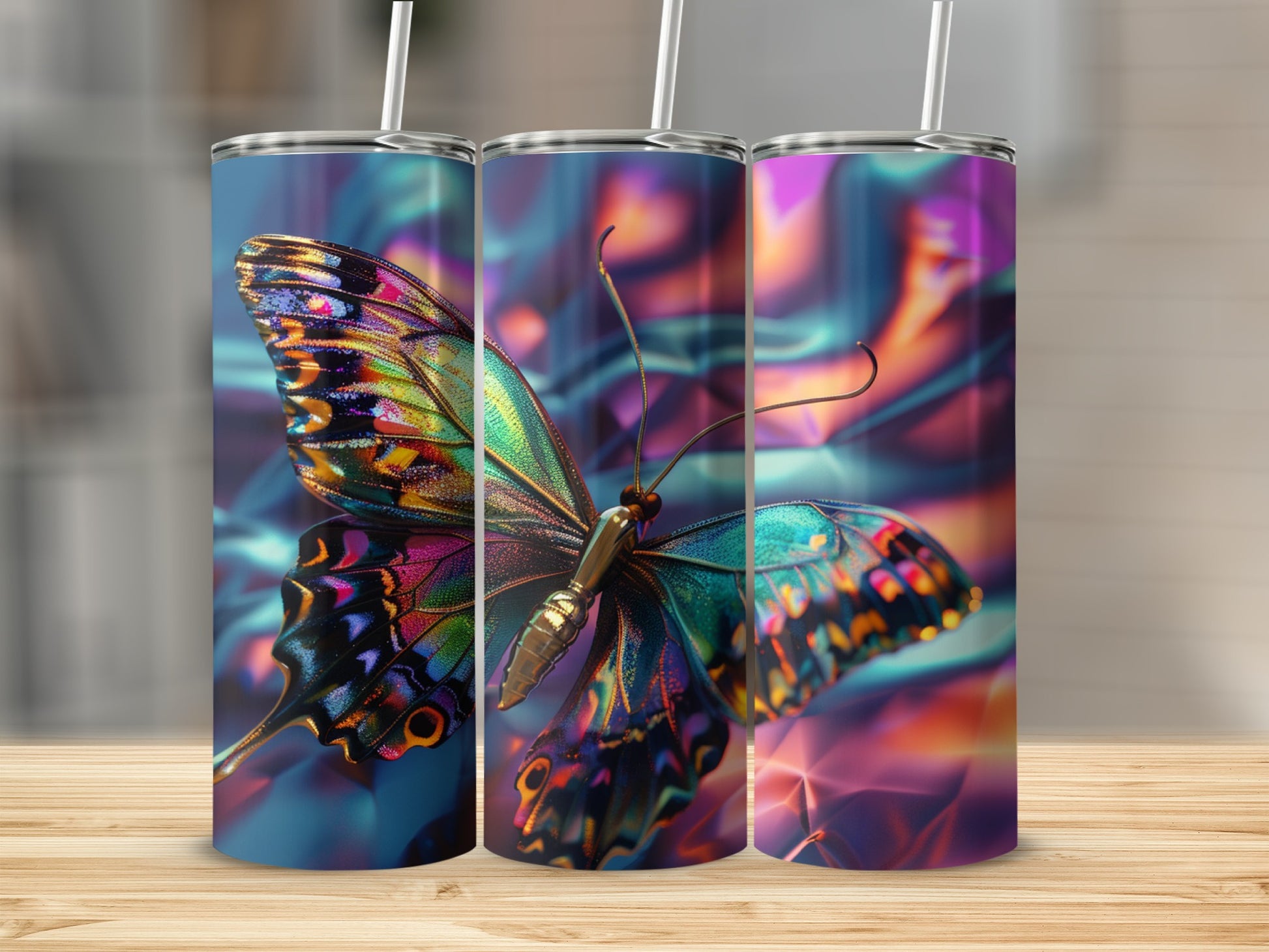 Three tumblers featuring iridescent butterfly wings on a blurred background.