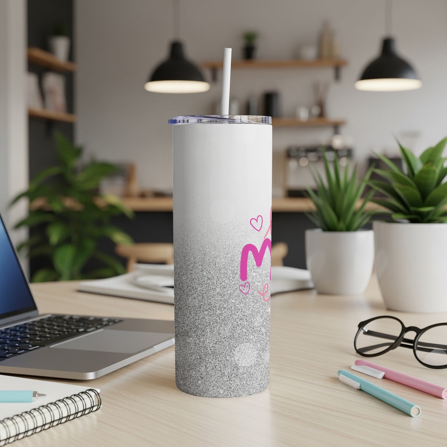 White tumbler with silver glitter ombre and pink "M" initial.