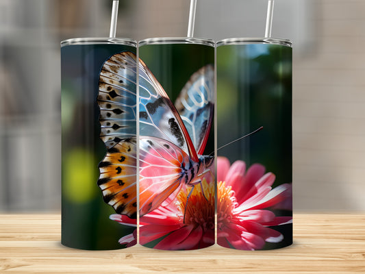 Three tumblers with a close-up of a butterfly on a pink flower.