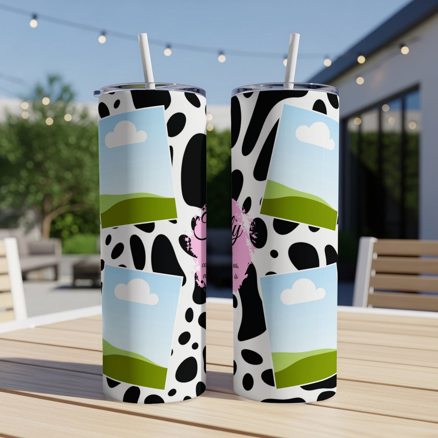 Two tall tumblers with cow print, landscape photos, and pink text.