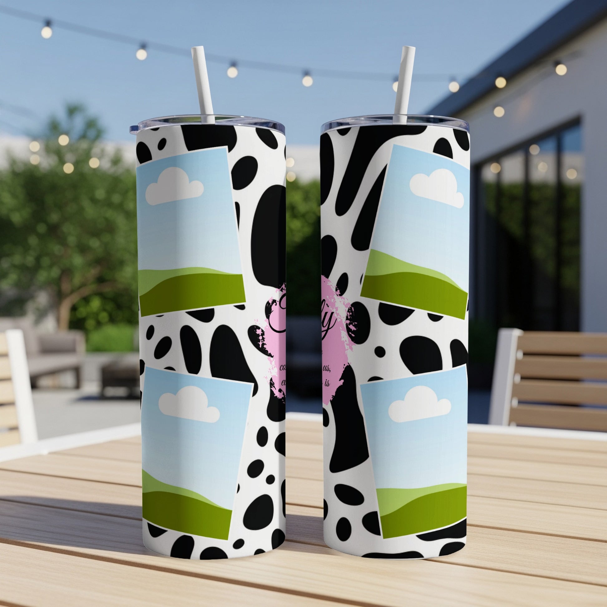Two tall tumblers with cow print, landscape photos, and pink text.