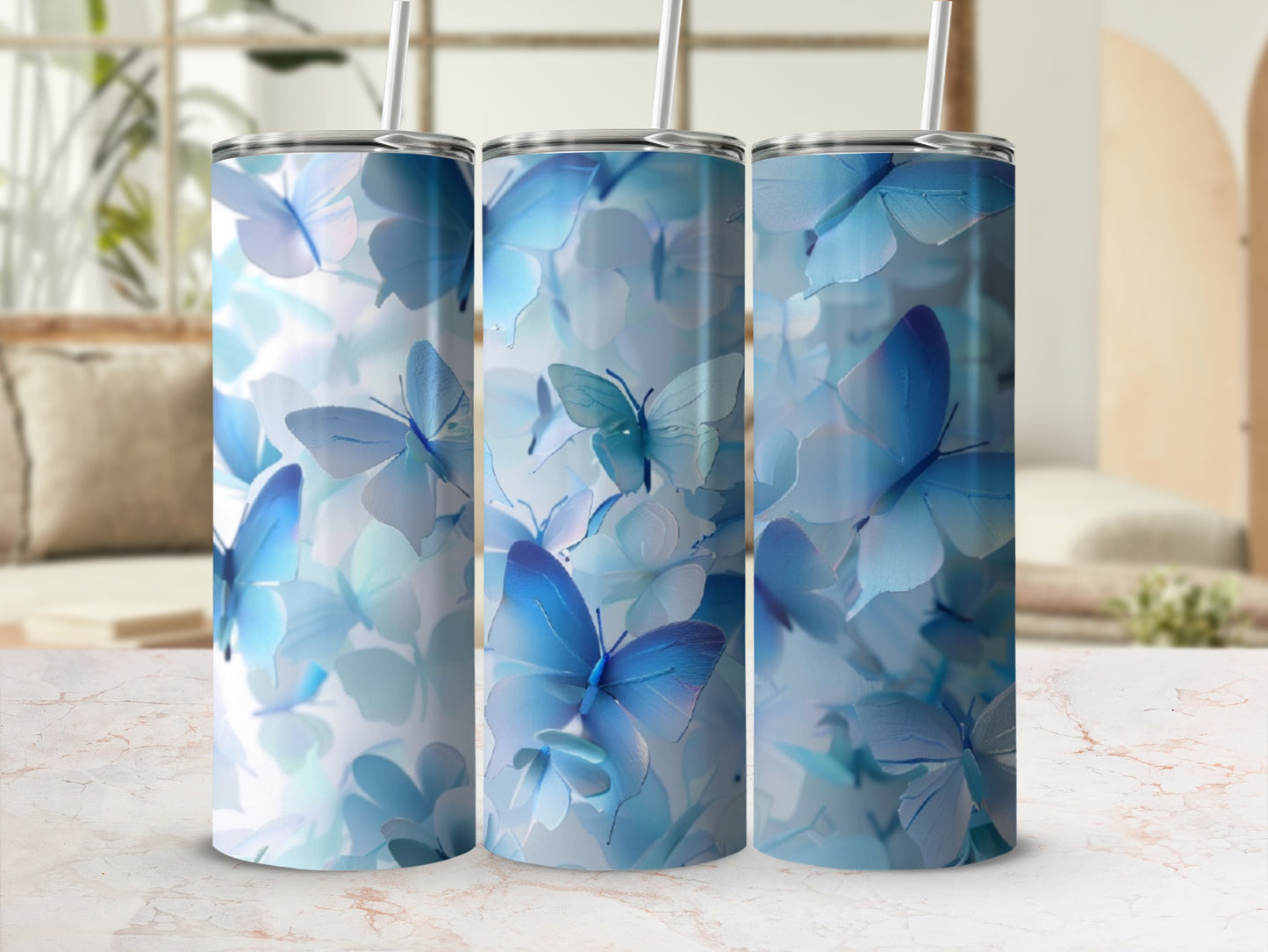 Three tumblers with a blue butterfly floral design.