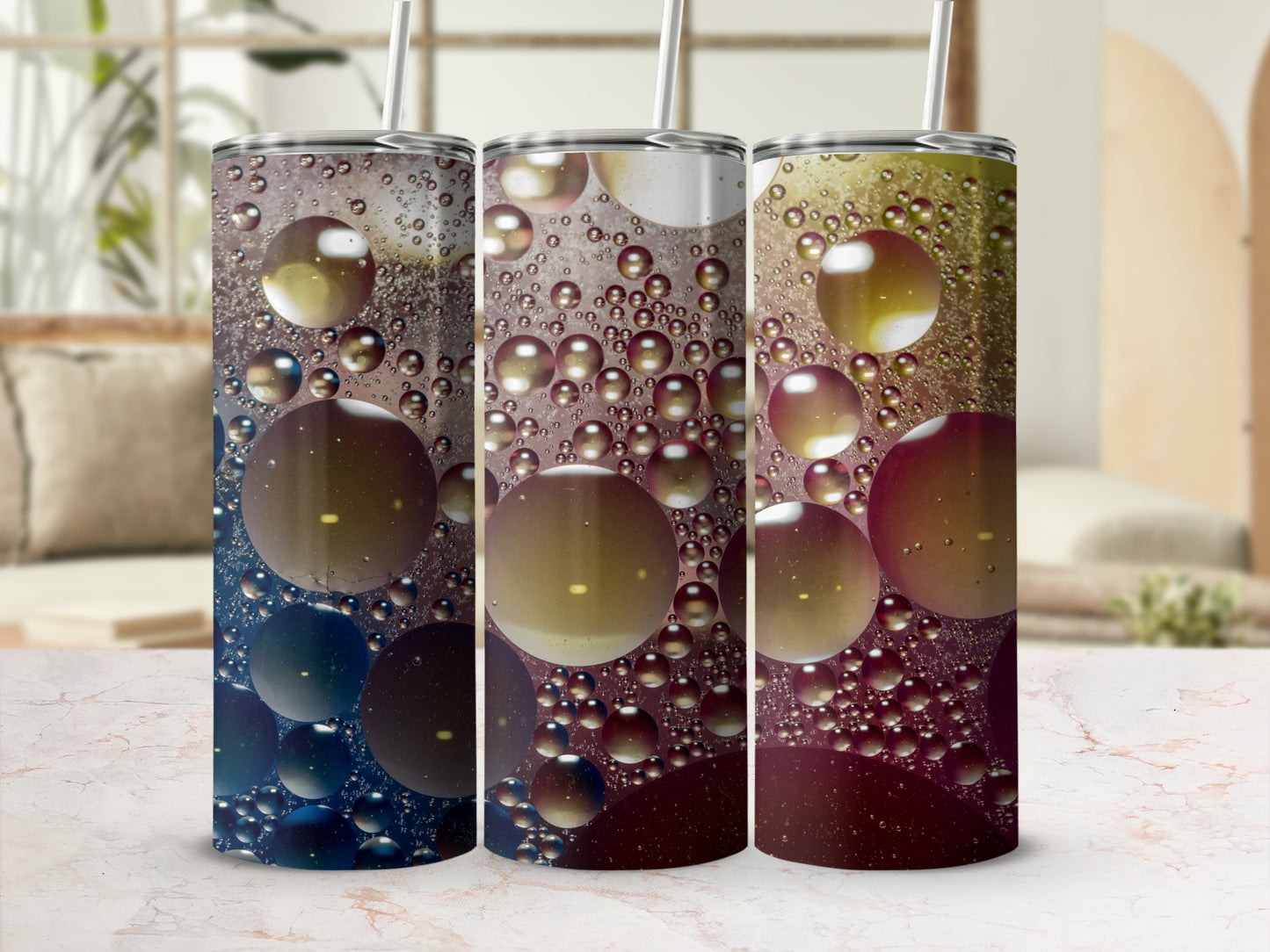Three tumblers with a colorful oil and water bubble pattern.