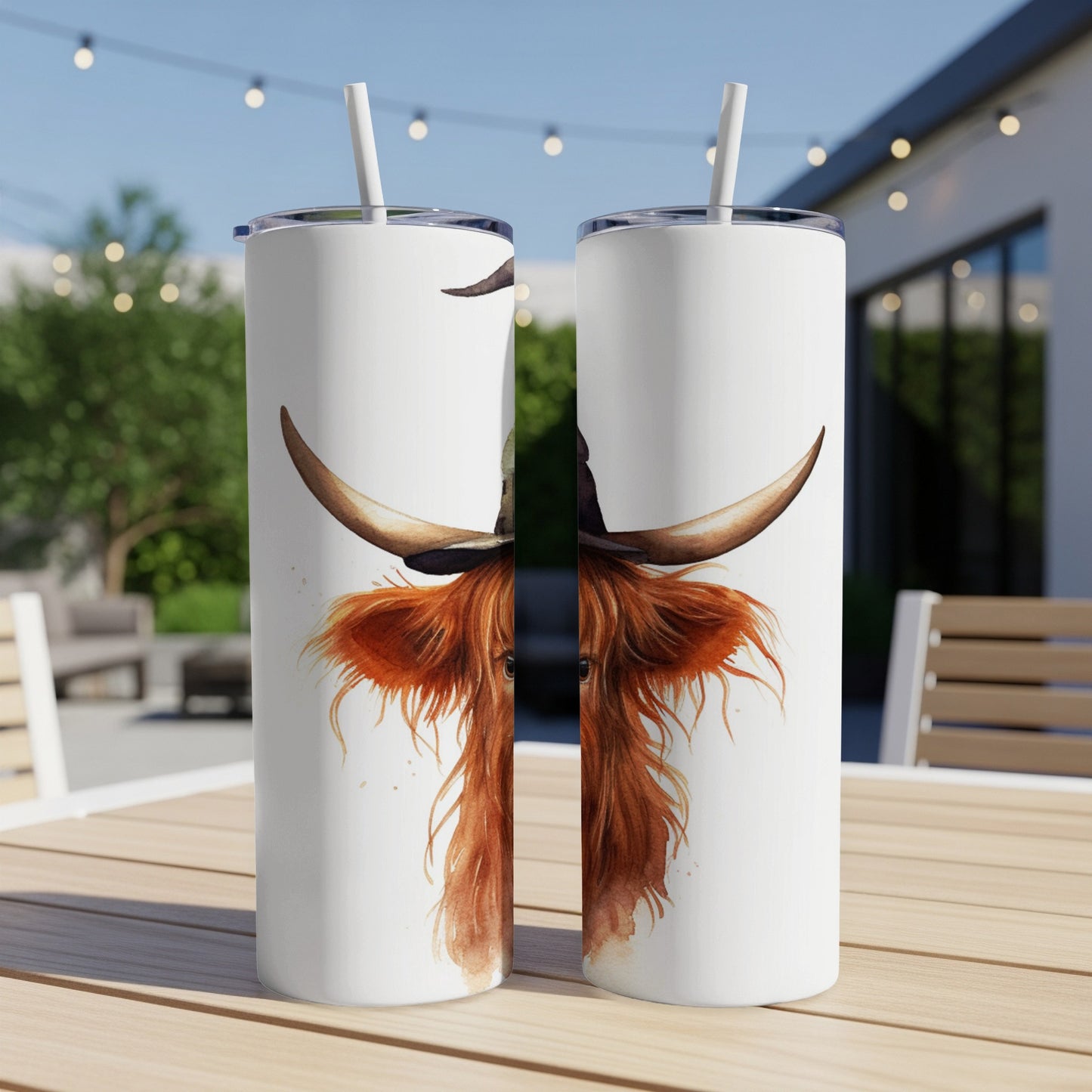 Two tumblers with a watercolor Highland cow wearing a hat.