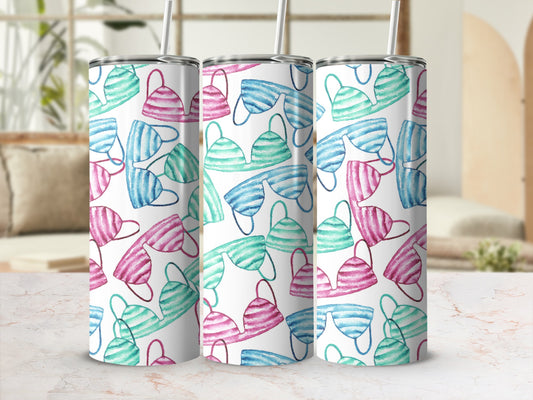 Three tumblers with a pink and teal watercolor bikini pattern.