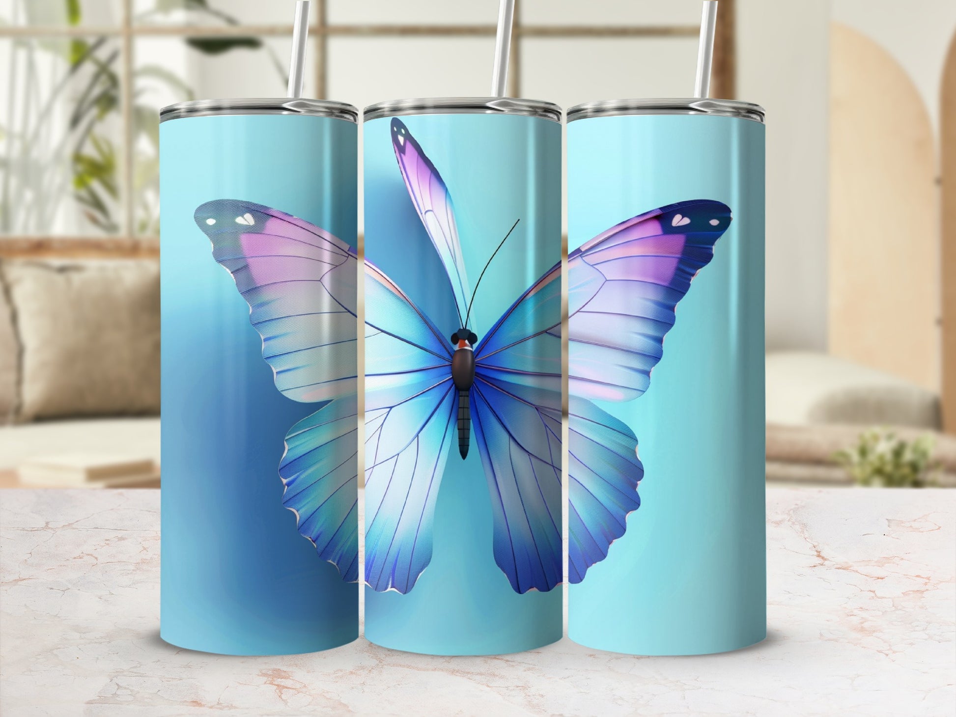 Three tall tumblers with a large purple and blue butterfly design.